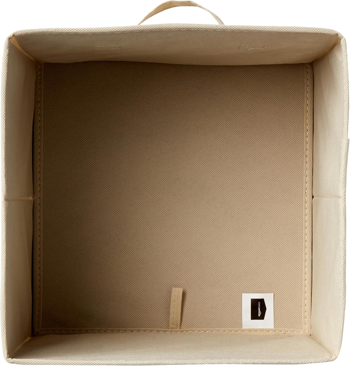Beige fabric cube bins organizing a modular shelf unit